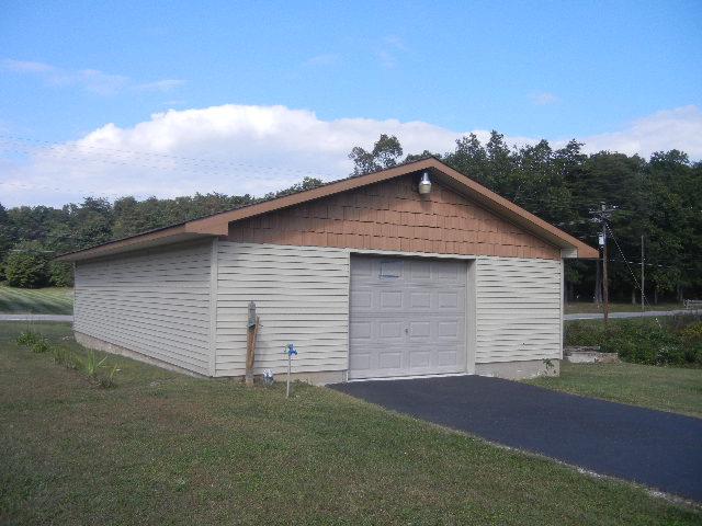12466 Highway 108 Altamont, TN 37301 - Photo 20 of 20 Detached Garage / Workshop measures 60x30 and will easily house 2 cars end-to-end. Look at it as a potential business or hobby area with electricity, concrete floor, & its own security system.