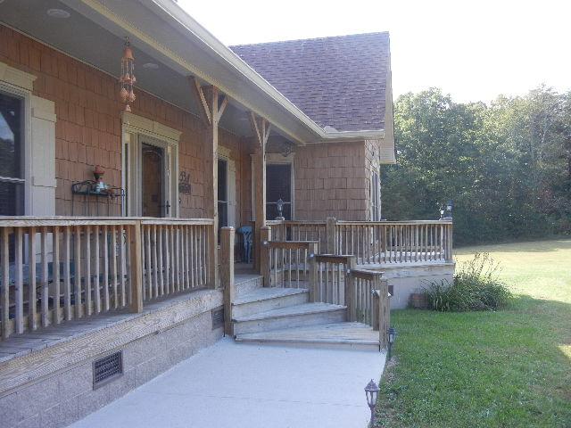 12466 Highway 108 Altamont, TN 37301 - Photo 2 of 20 A true Gathering Porch right in the front. Enjoy a glass of iced tea on the porch without a neighbor insight!