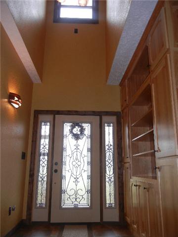 12466 Highway 108 Altamont, TN 37301 - Photo 3 of 20 A Welcoming Entry Foyer is adorned with a beautifully unique door, warm paint colors, and built-in case for your books or collectibles.