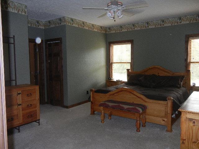 12466 Highway 108 Altamont, TN 37301 - Photo 7 of 20 The Owners Suite features 2 walk-in closets, bright windows, and a trey ceiling.
