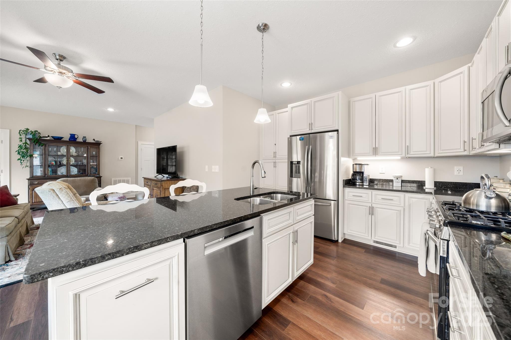9 Vedder Way Swannanoa, NC 28778 - Photo 13 of 33 a kitchen with kitchen island granite countertop a sink appliances and cabinets