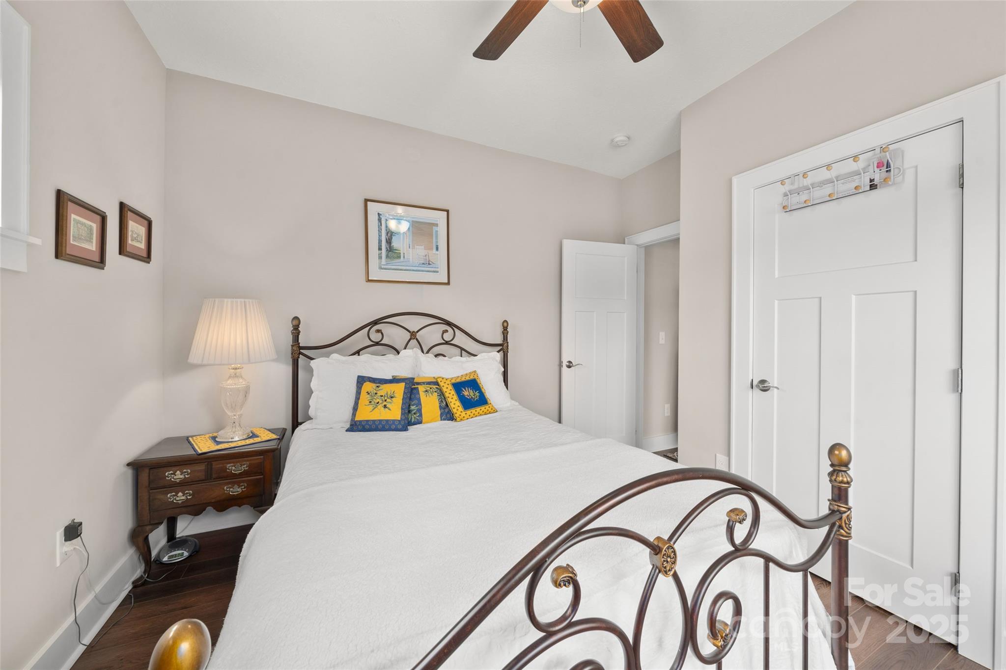 9 Vedder Way Swannanoa, NC 28778 - Photo 24 of 33 a bedroom with a bed and a chandelier
