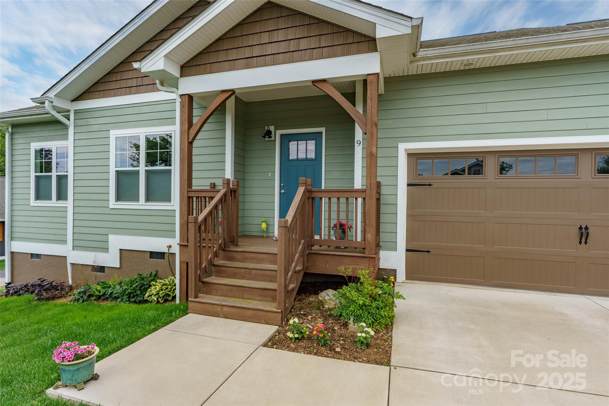 9 Vedder Way Swannanoa, NC 28778 - Photo 29 of 33 a front view of a house with garden