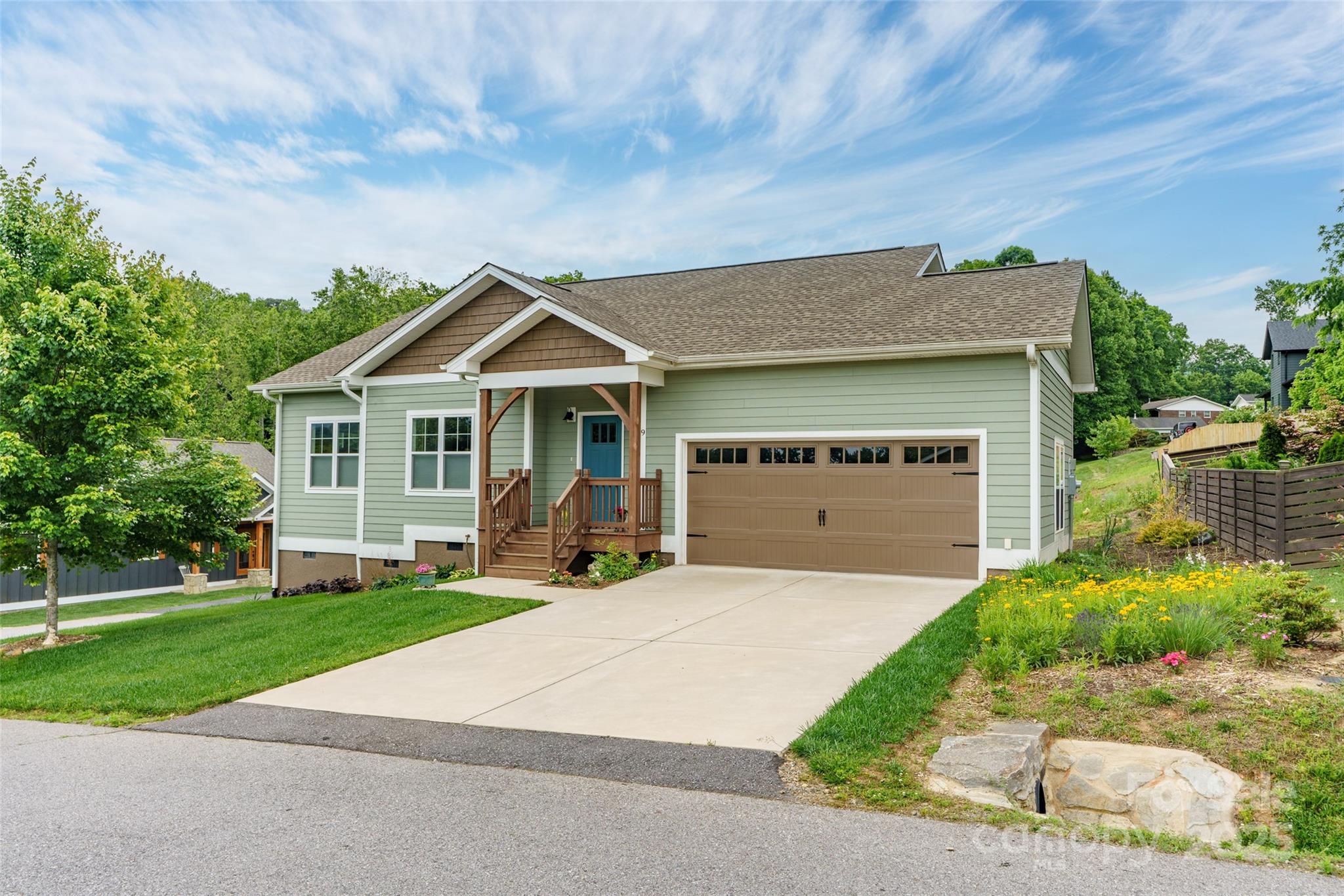 9 Vedder Way Swannanoa, NC 28778 - Photo 33 of 33 a front view of a house with a yard and garage