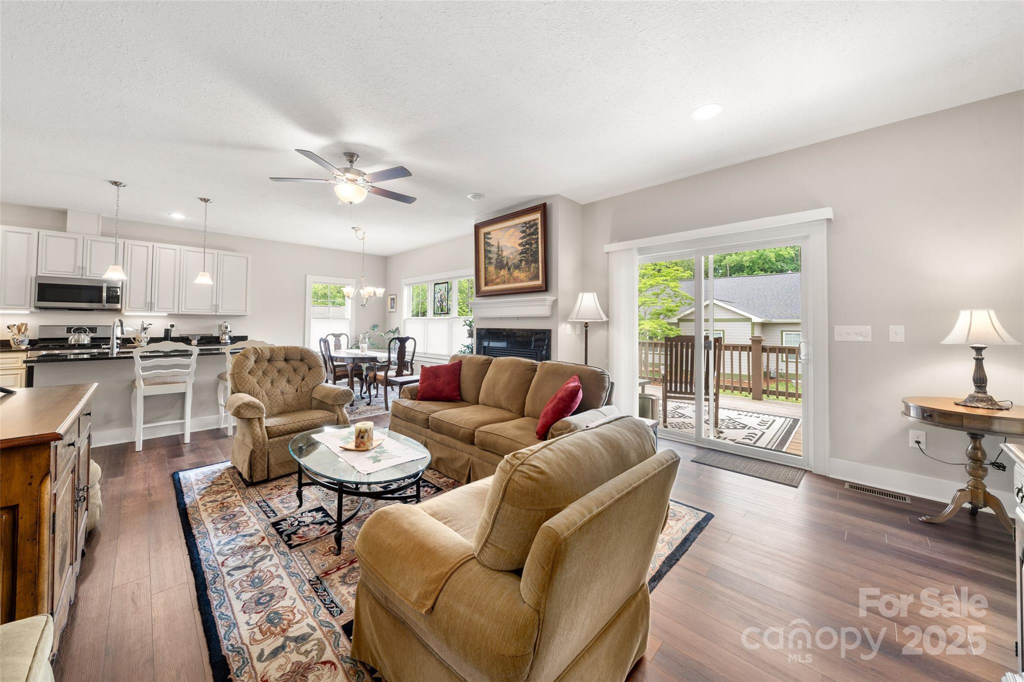 9 Vedder Way Swannanoa, NC 28778 - Photo 5 of 33 a living room with furniture a fireplace and a flat screen tv