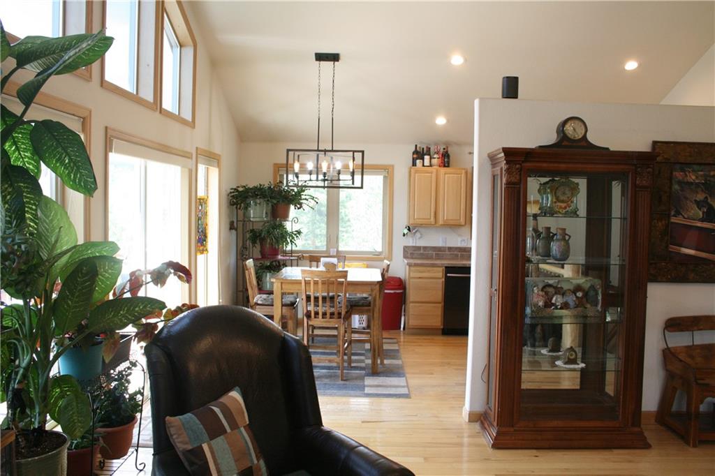 960 Sheep Ridge Road Fairplay, CO 80440 - Photo 13 of 34 a view of a dining room with furniture window and wooden floor