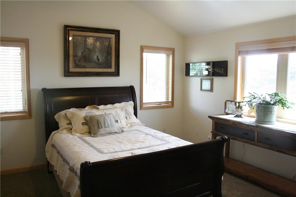 960 Sheep Ridge Road Fairplay, CO 80440 - Photo 17 of 34 a bedroom with a bed and a table