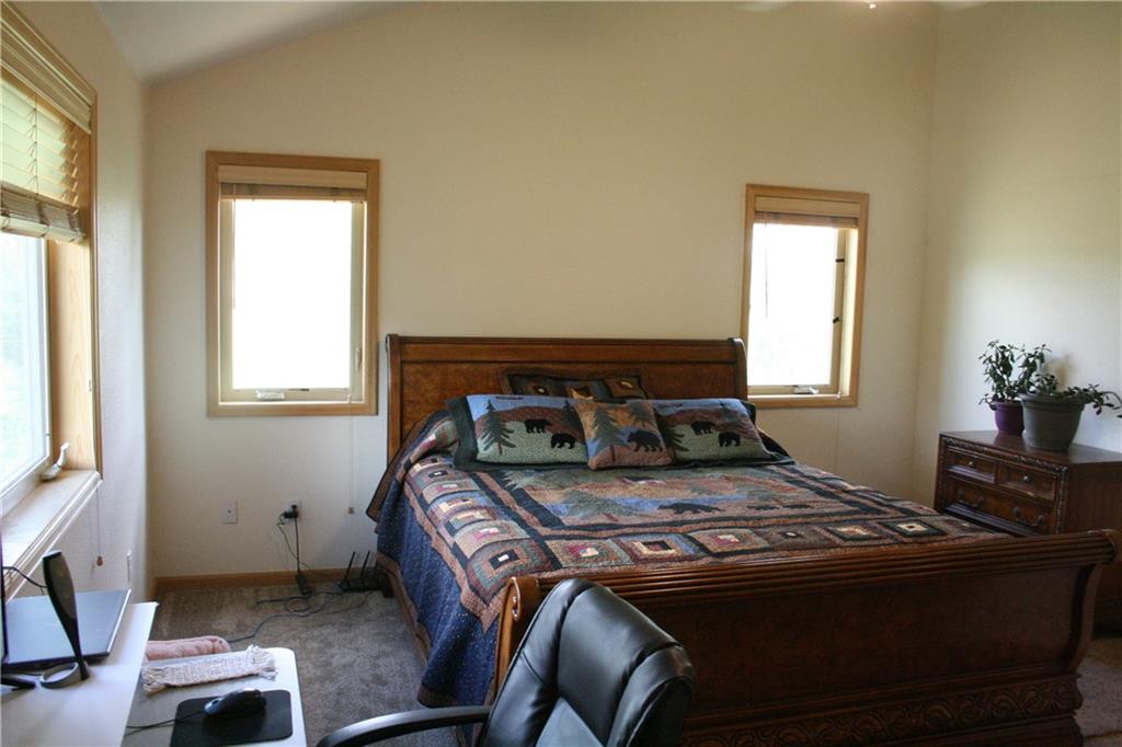 960 Sheep Ridge Road Fairplay, CO 80440 - Photo 20 of 34 a bed sitting in a bedroom next to a window