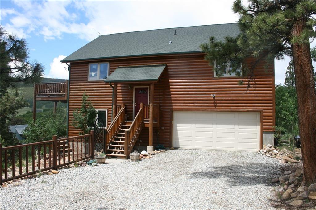 960 Sheep Ridge Road Fairplay, CO 80440 - Photo 3 of 34 a front view of a house with a garage