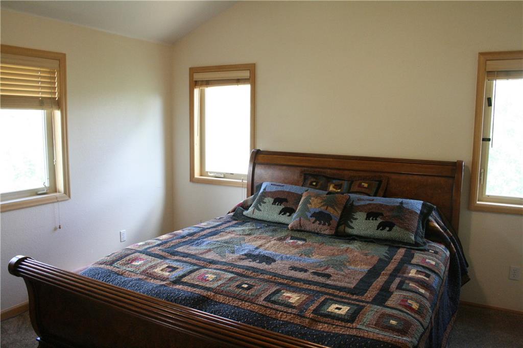 960 Sheep Ridge Road Fairplay, CO 80440 - Photo 23 of 34 a bedroom with a bed and a window