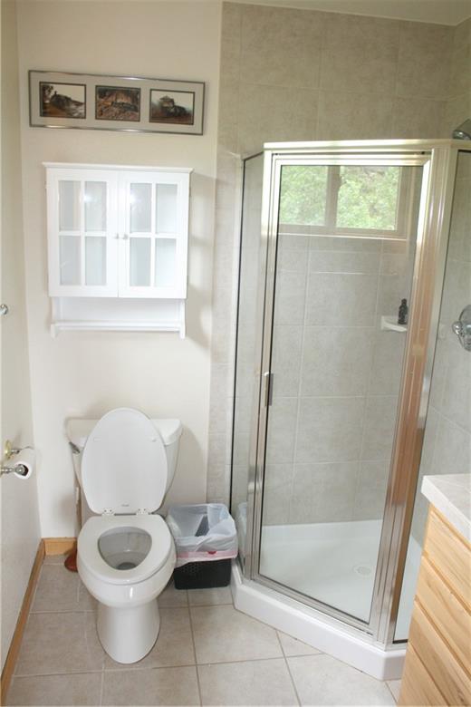 960 Sheep Ridge Road Fairplay, CO 80440 - Photo 24 of 34 a white toilet sitting next to a bathroom sink