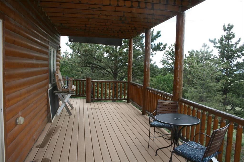 960 Sheep Ridge Road Fairplay, CO 80440 - Photo 26 of 34 a view of a balcony with chairs and wooden floor