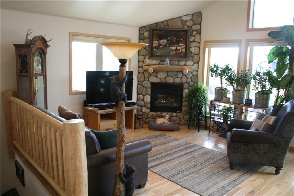 960 Sheep Ridge Road Fairplay, CO 80440 - Photo 5 of 34 a living room with furniture a flat screen tv and a fireplace