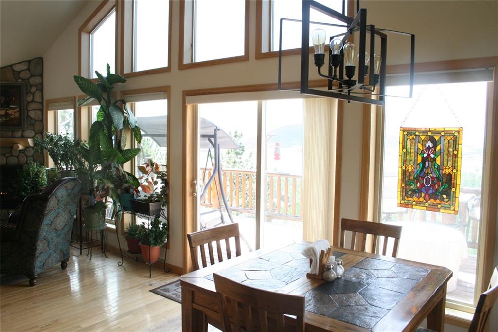 960 Sheep Ridge Road Fairplay, CO 80440 - Photo 9 of 34 a view of a dining room with furniture and window