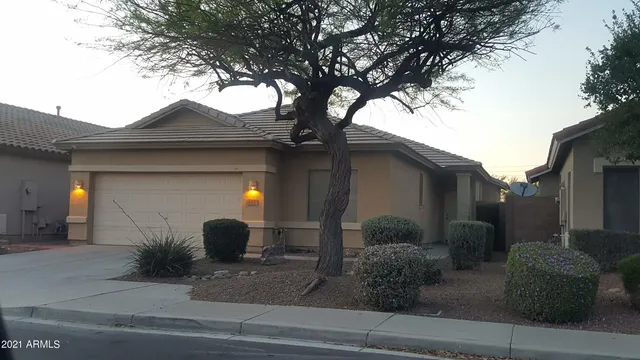 a front view of a house with garage