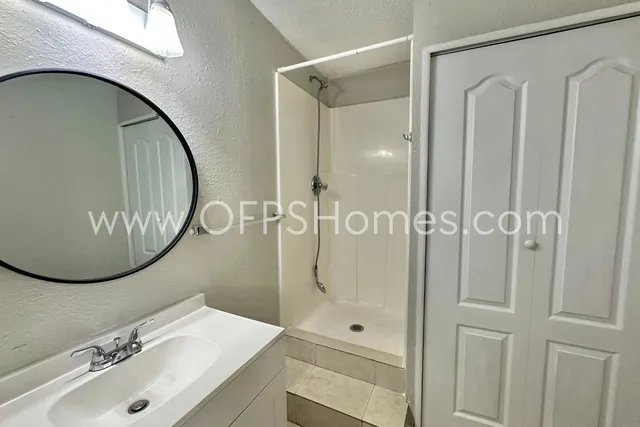 a view of a hallway with a chandelier