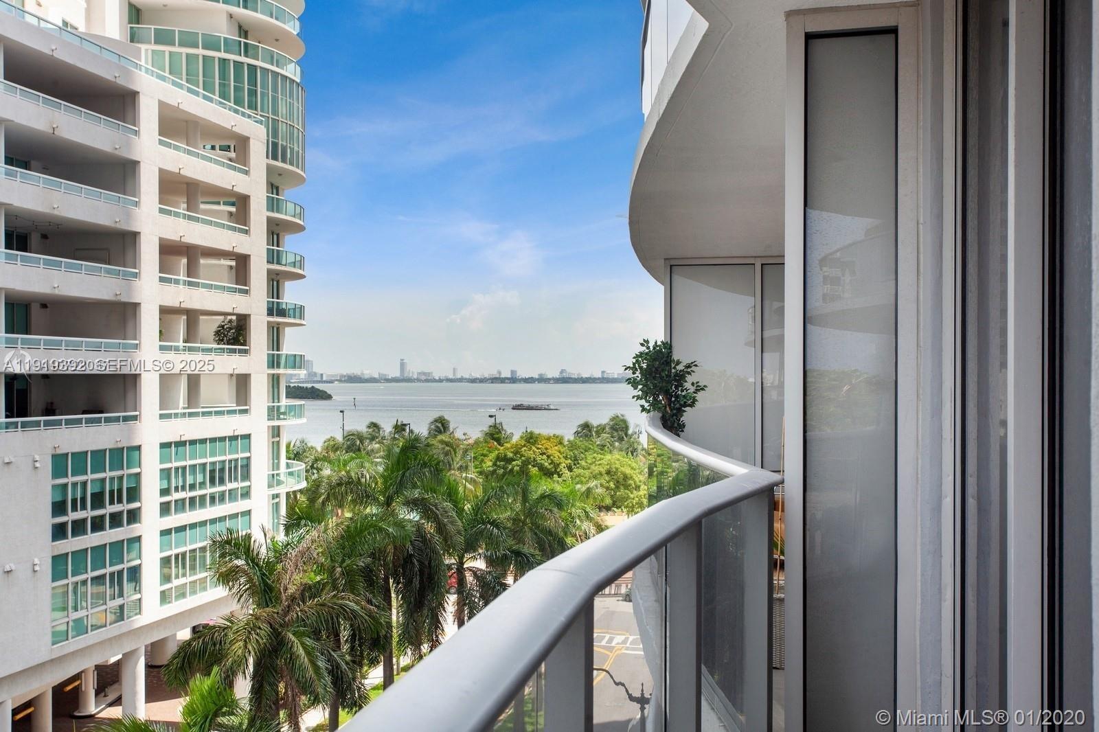 488 Northeast 18th Street, Unit 501 Miami, FL 33132 - Photo 17 of 29 a view of balcony with wooden floor and a potted plant