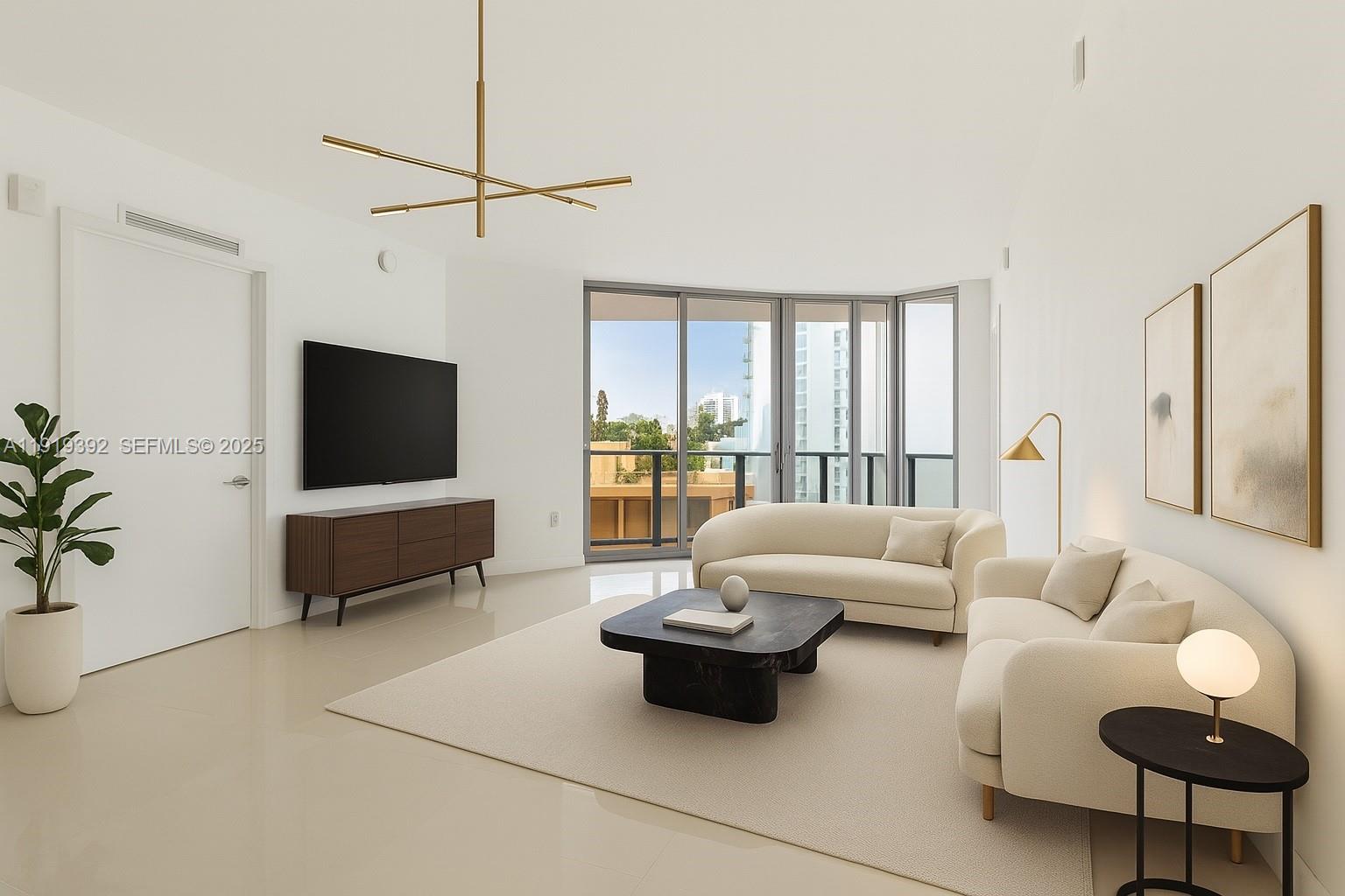 488 Northeast 18th Street, Unit 501 Miami, FL 33132 - Photo 2 of 29 a living room with furniture and a flat screen tv