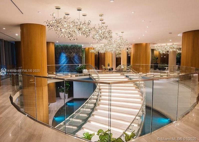 488 Northeast 18th Street, Unit 501 Miami, FL 33132 - Photo 21 of 29 a swimming pool with outdoor seating and yard