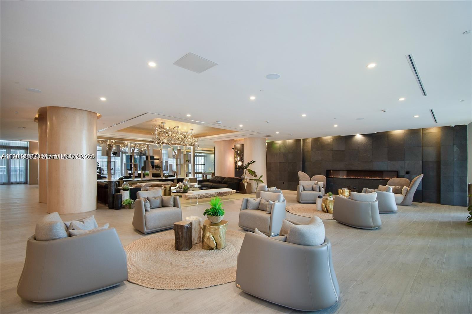 488 Northeast 18th Street, Unit 501 Miami, FL 33132 - Photo 26 of 29 a living room with furniture and a flat screen tv