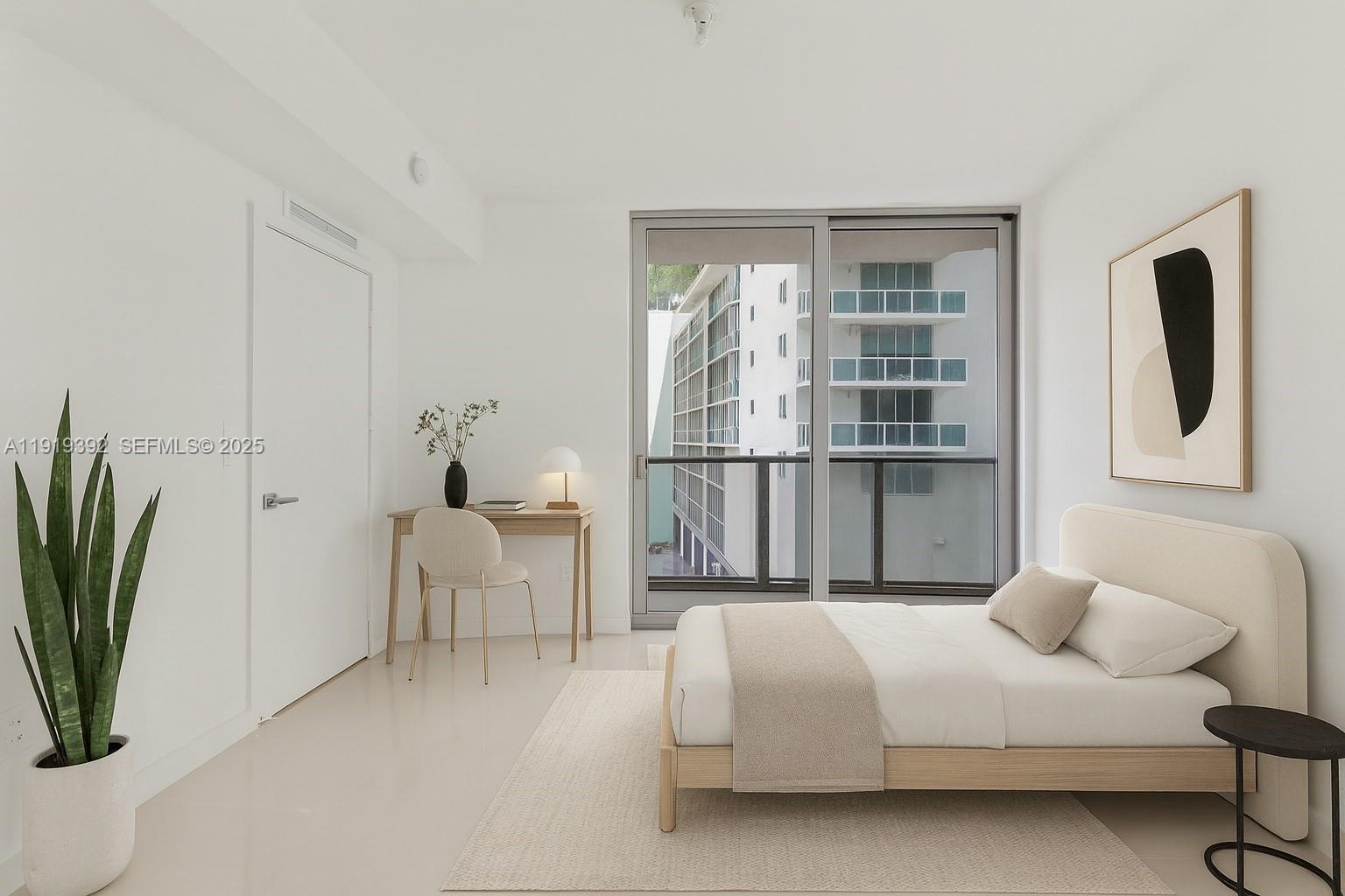 488 Northeast 18th Street, Unit 501 Miami, FL 33132 - Photo 3 of 29 a bedroom with a large bed and a potted plant