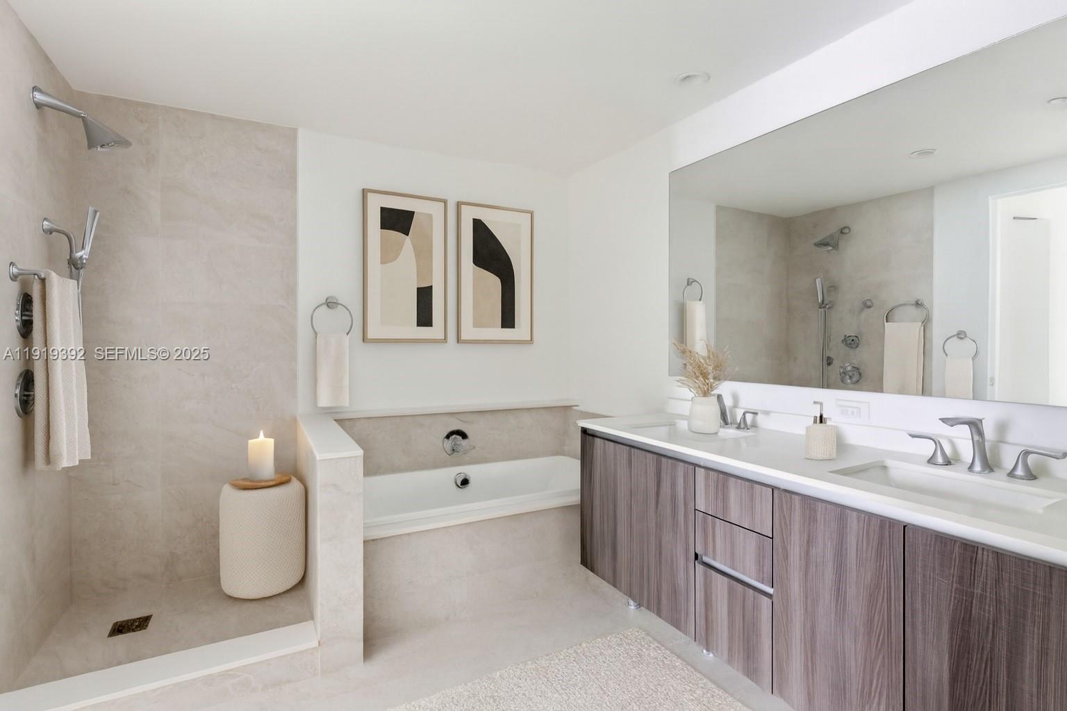 488 Northeast 18th Street, Unit 501 Miami, FL 33132 - Photo 4 of 29 a bathroom with a double vanity sink toilet and shower