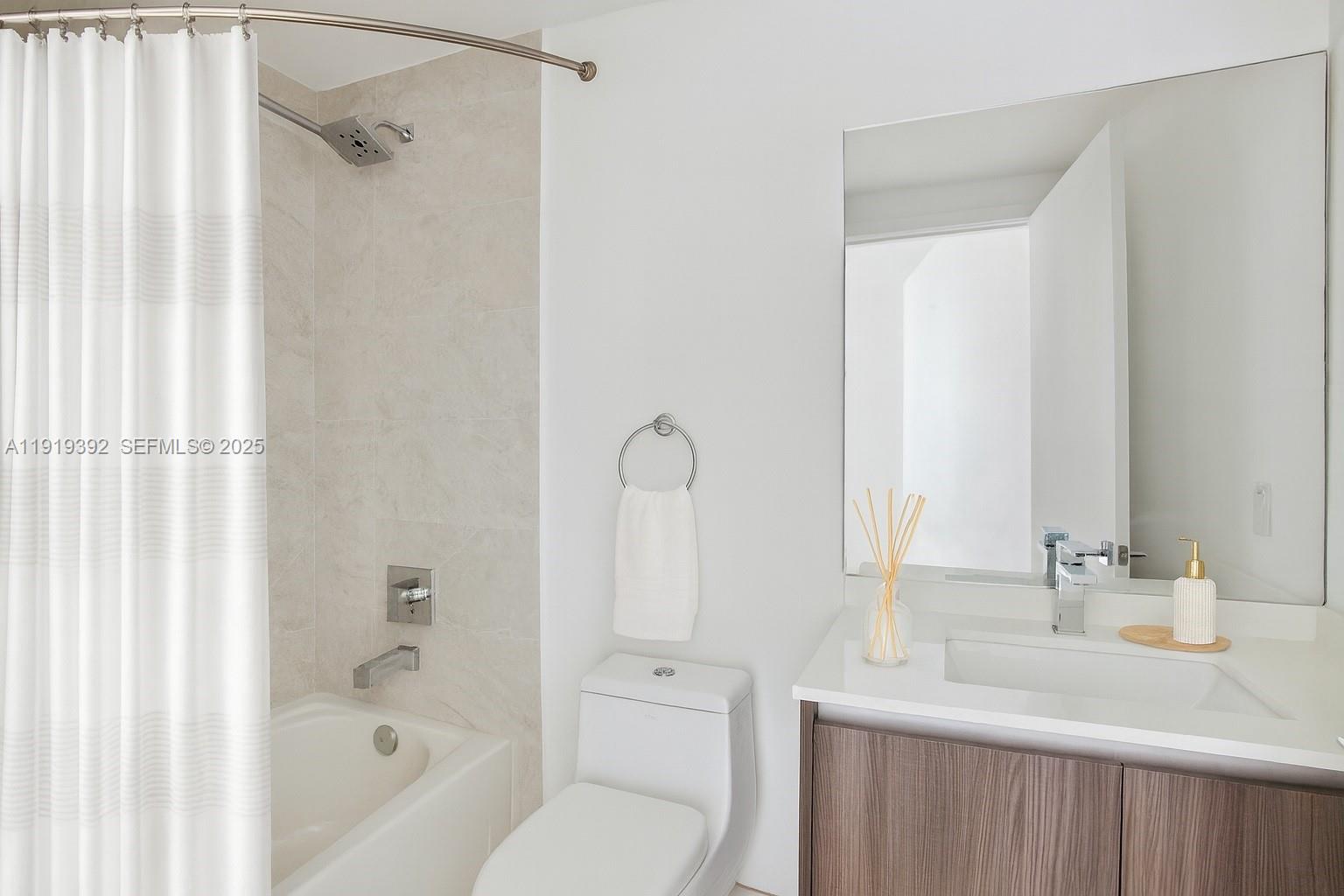 488 Northeast 18th Street, Unit 501 Miami, FL 33132 - Photo 6 of 29 a bathroom with a sink toilet and shower