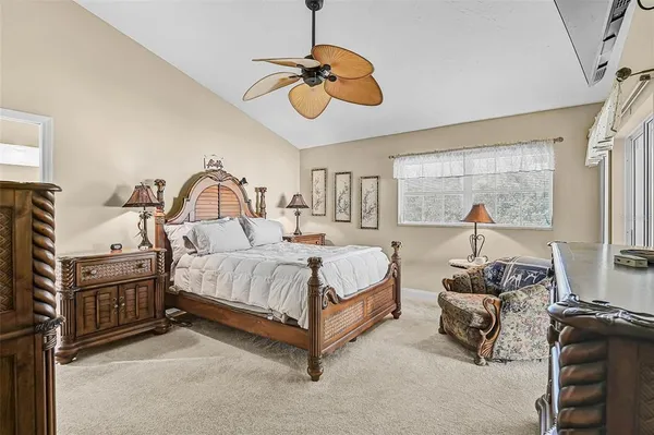 a bed room with a bed and a chandelier