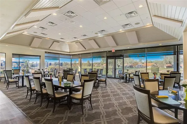 a group of people sitting at tables in a room
