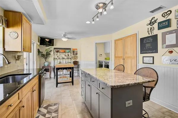 a kitchen with a sink stove and refrigerator