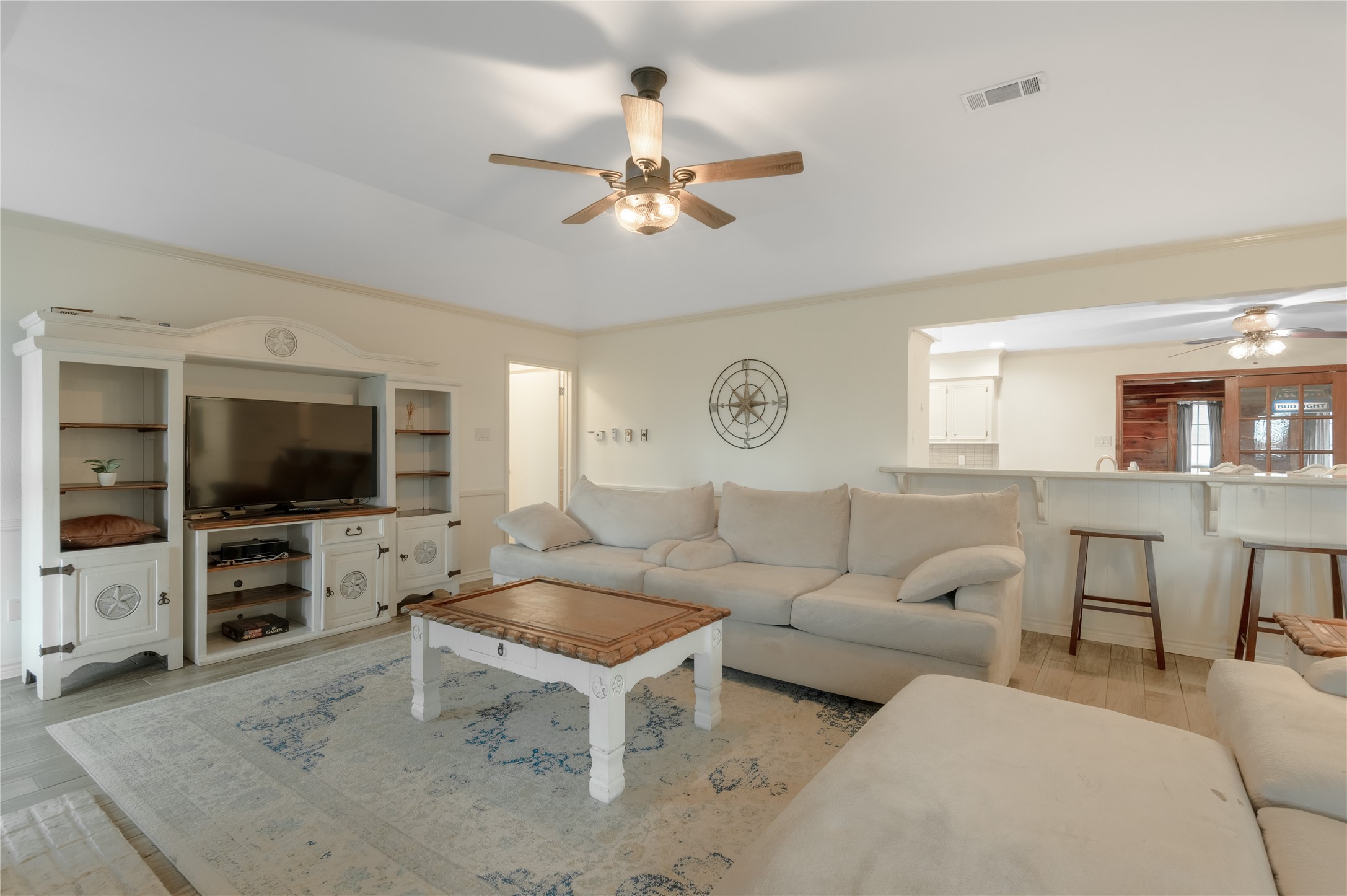 758 Wire Road Huntsville, TX 77320 - Photo 16 of 44 a living room with furniture and a flat screen tv