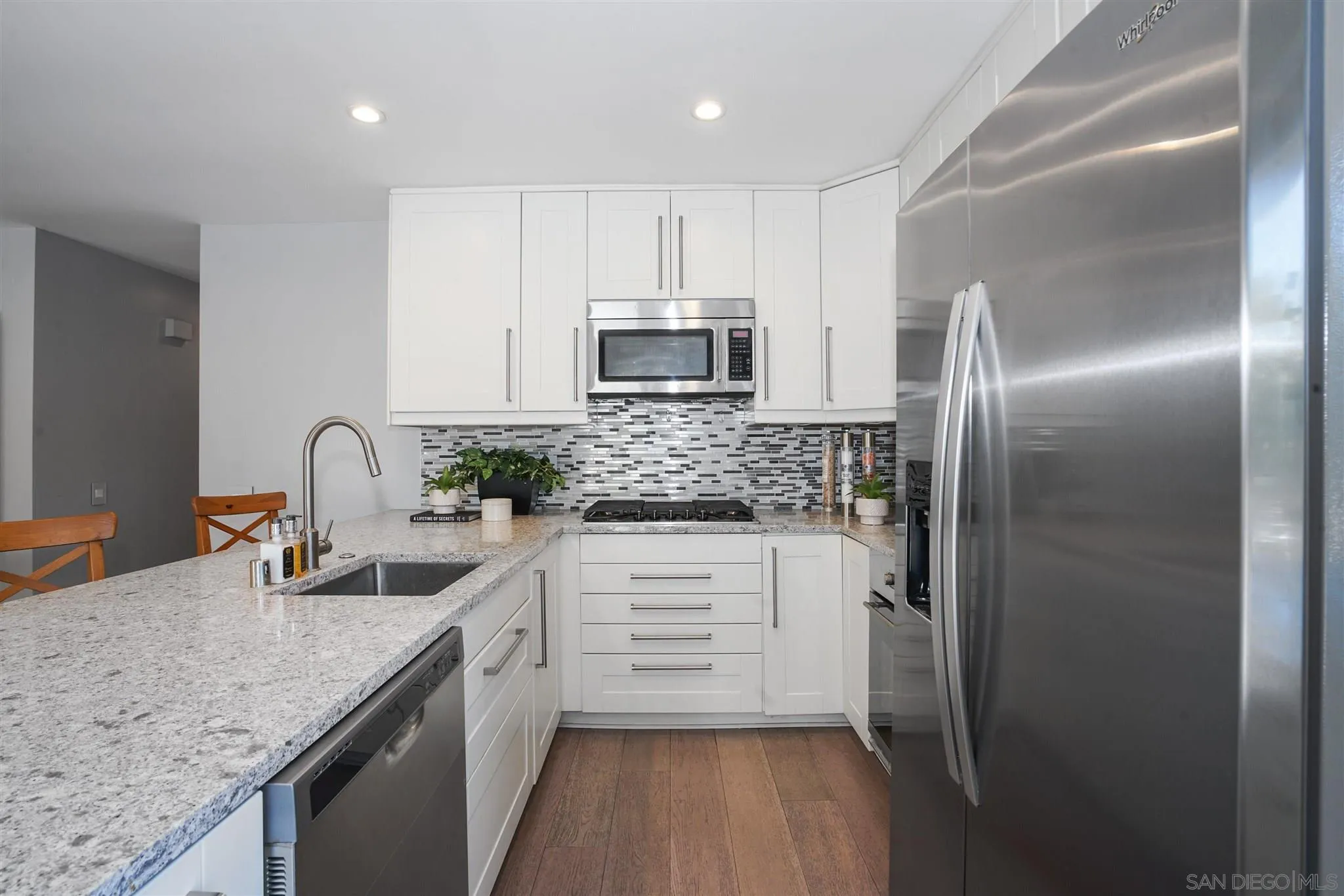 744 Pyramid Point Way Oceanside, CA 92058 - Photo 3 of 20 a kitchen with stainless steel appliances granite countertop a sink stove and refrigerator