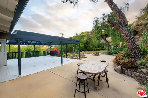 a view of a balcony with wooden floor