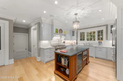 a kitchen with sink and center island