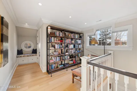 a bedroom with a bed and a fireplace