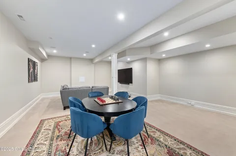 a room with furniture and gym equipment