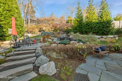 a view of a chairs and table in patio
