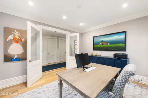 a dining room with furniture a rug and wooden floor