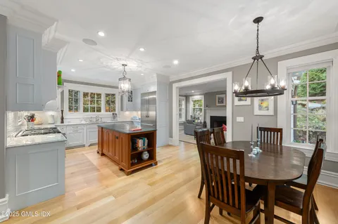 a kitchen with stainless steel appliances granite countertop a stove and a refrigerator