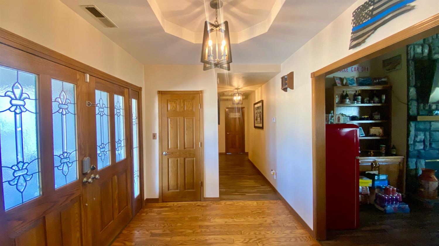 5012 Ustick Road Modesto, CA 95358 - Photo 12 of 26 a view of a hallway with wooden floor and staircase