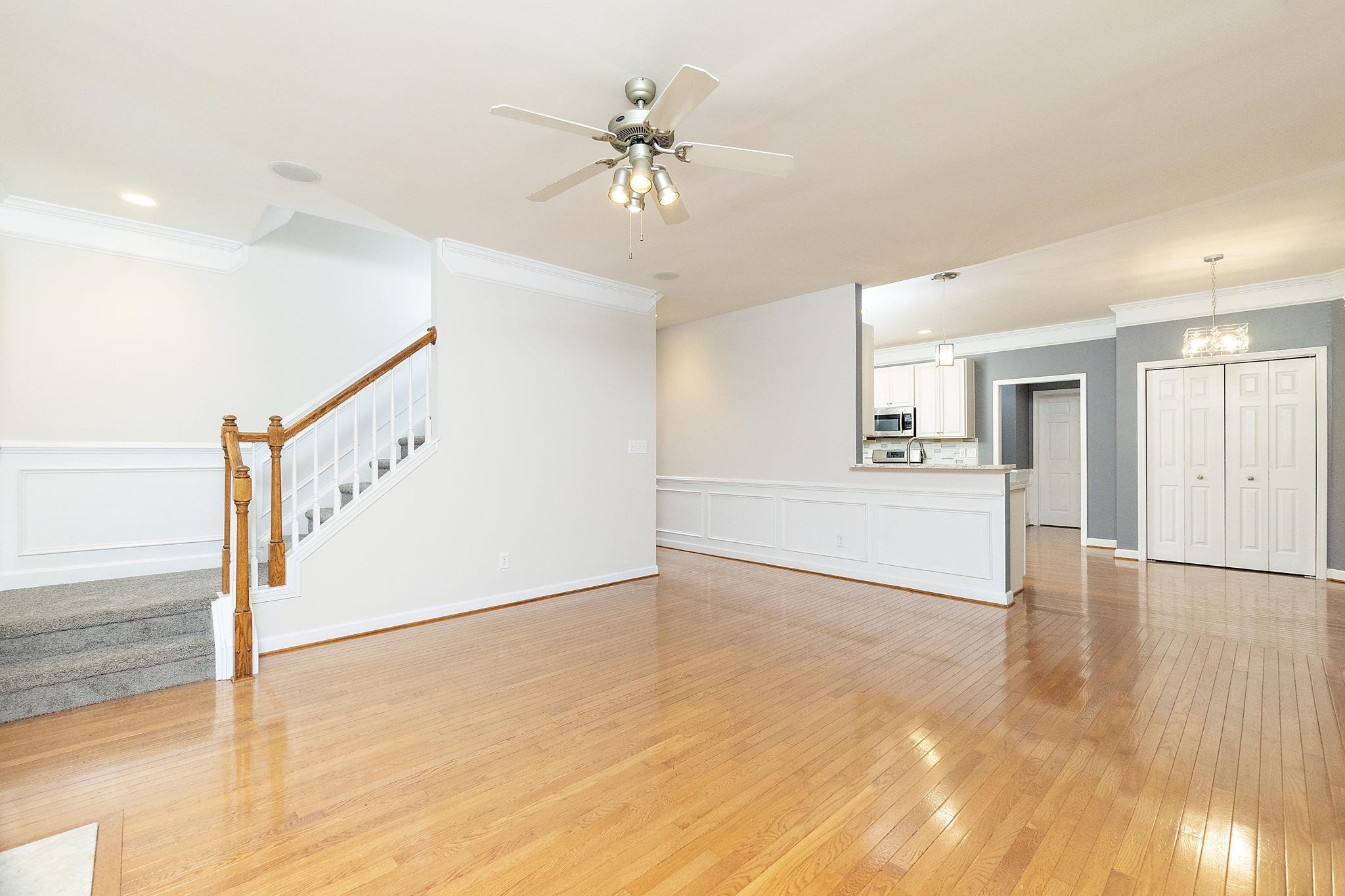 5916 Currin Fox Court Raleigh, NC 27616 - Photo 11 of 43 a view of an empty room with window and wooden floor