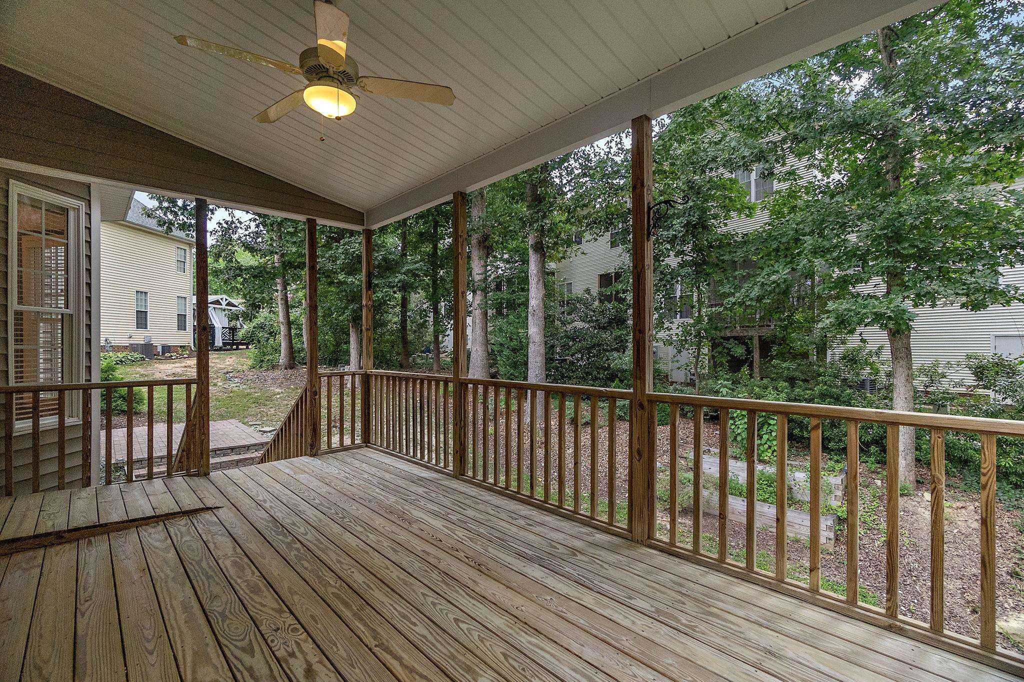 5916 Currin Fox Court Raleigh, NC 27616 - Photo 3 of 43 a view of a balcony with wooden floor