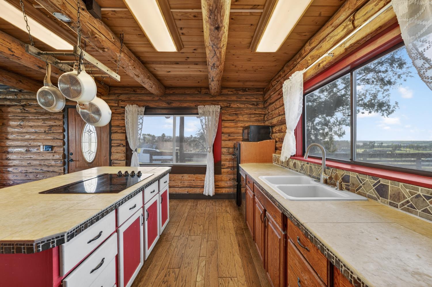 9798 Butte View Marysville, CA 95901 - Photo 14 of 55 a kitchen with stainless steel appliances granite countertop a sink and a large window