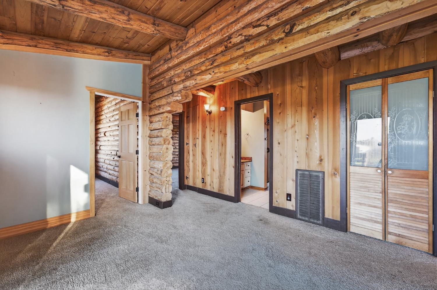 9798 Butte View Marysville, CA 95901 - Photo 20 of 55 an empty room with closet and mirrors