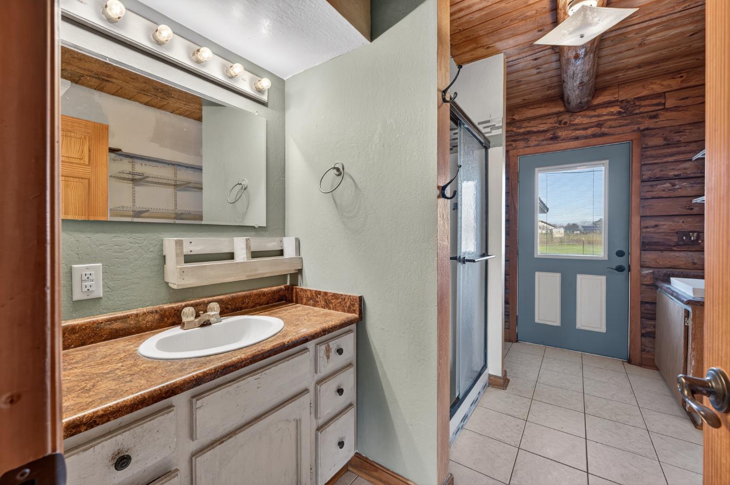 9798 Butte View Marysville, CA 95901 - Photo 22 of 55 a bathroom with a sink double vanity and a mirror