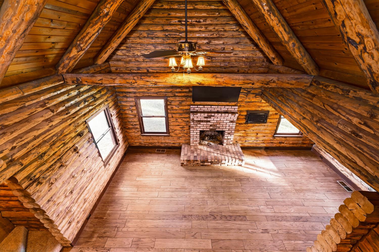 9798 Butte View Marysville, CA 95901 - Photo 31 of 55 a view of an empty room with wooden floor and windows