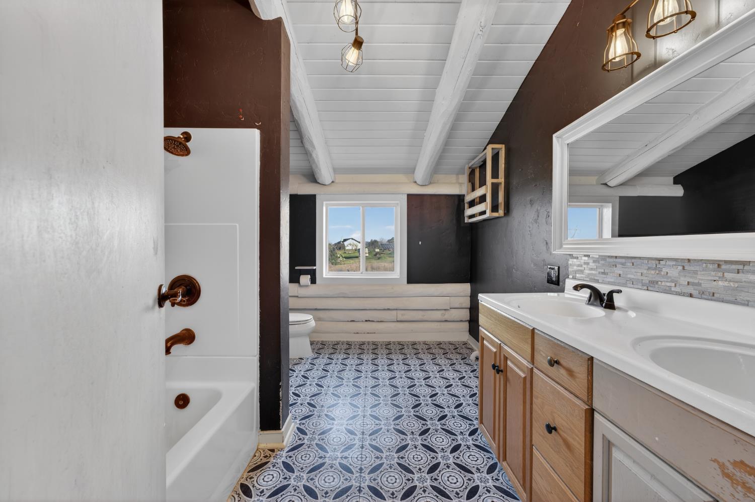 9798 Butte View Marysville, CA 95901 - Photo 34 of 55 a bathroom with a sink a mirror and shower