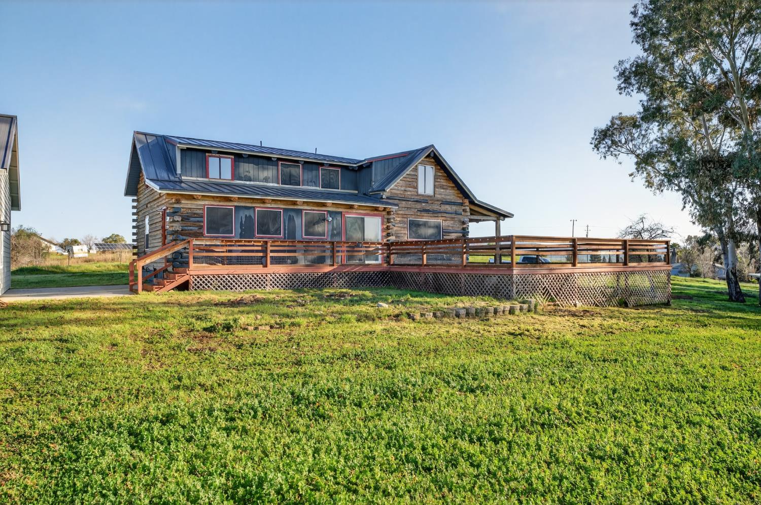 9798 Butte View Marysville, CA 95901 - Photo 46 of 55 a front view of a house with a yard table and chairs