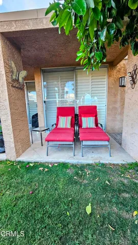 a view of a garden with a building in the background