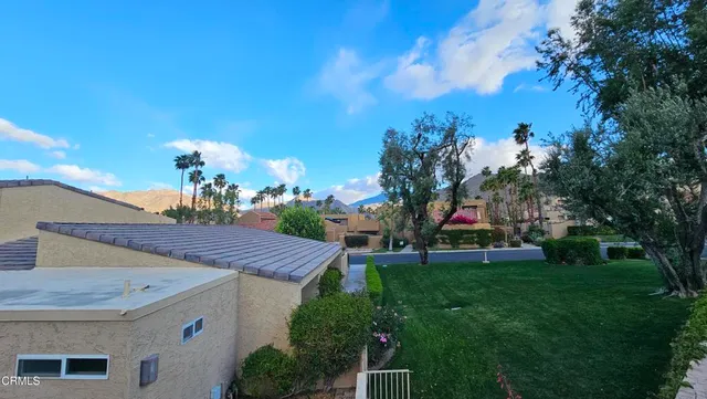 a view of a porch in front of house with a yard